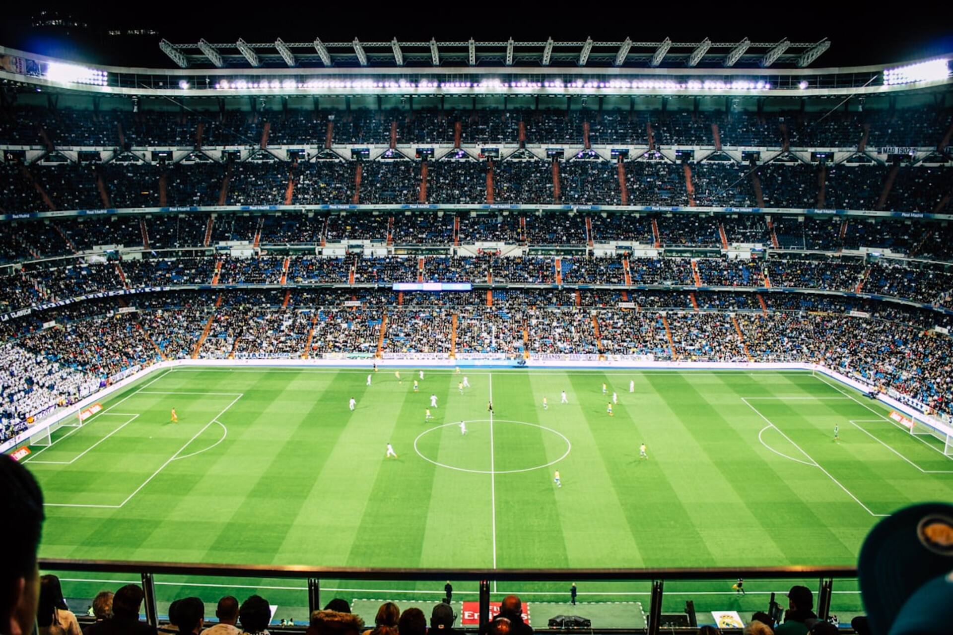 Floodlit stadium at night
